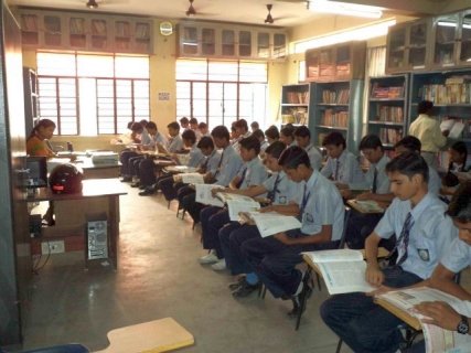 book reading by student in Library of  G.D. Mother International School Muzaffarpur